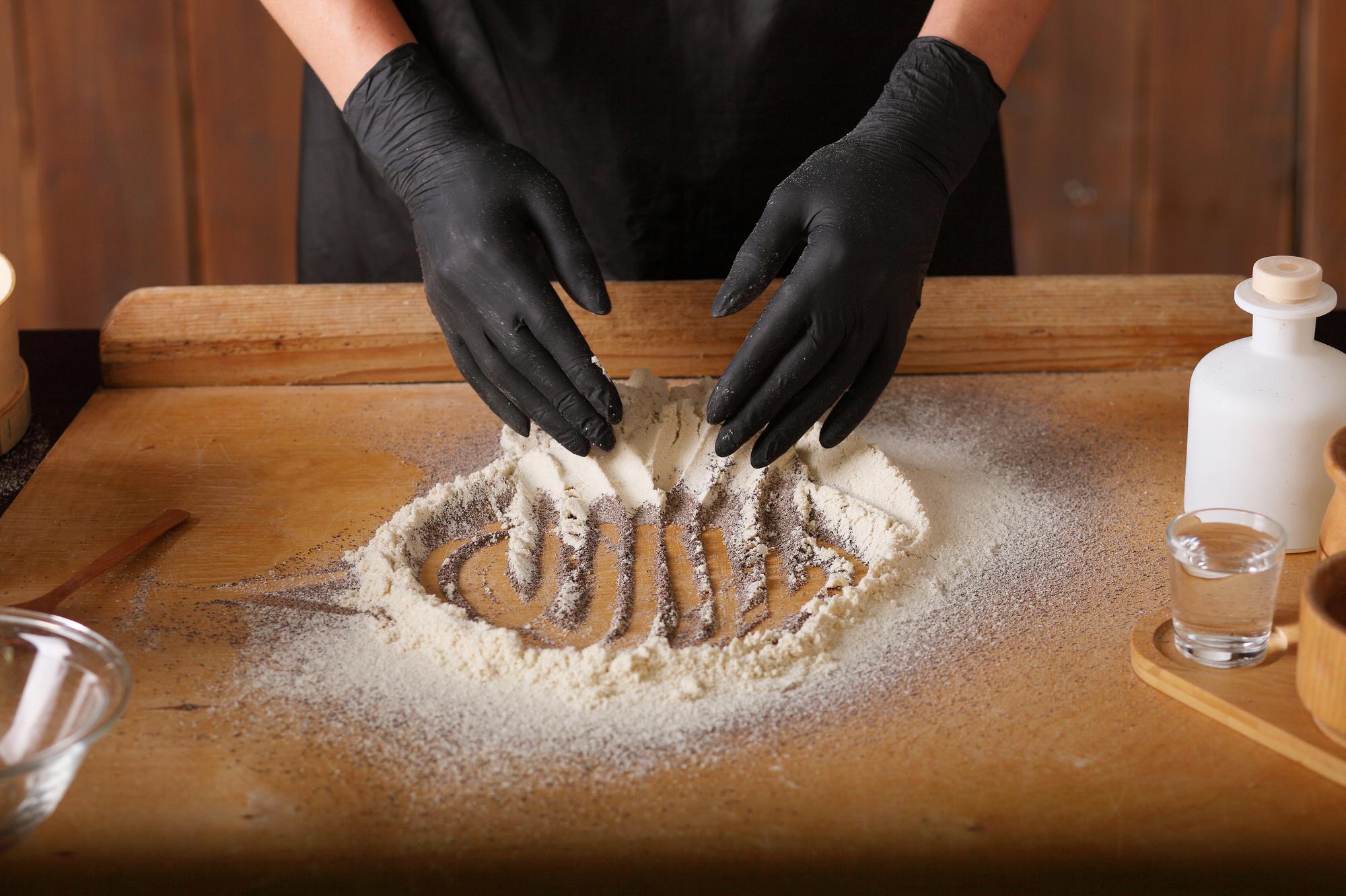 Hands preparing dough